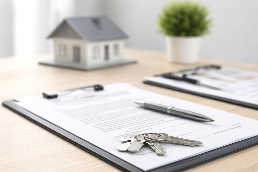 Closing process: documents and keys on desk